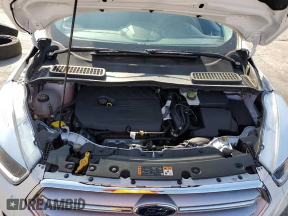 2018 Ford Escape SE with VIN 1FMCU9GDXJUB59001, listed as a Copart auction lot 84057235 with 60,517 mi miles and Salvage title. Bid and sale history available at DreamBid. Image 12.