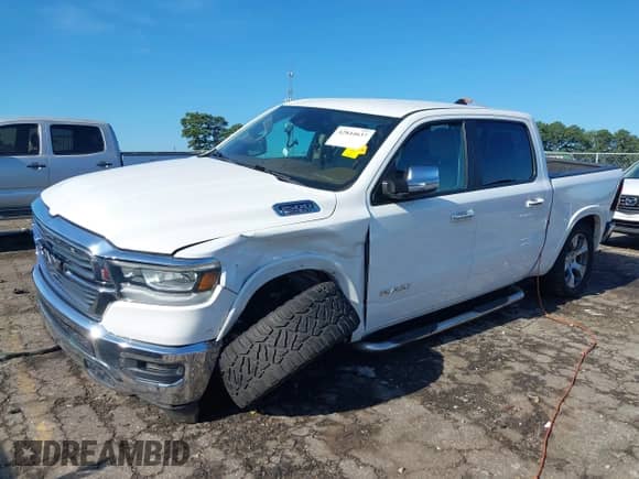 2021 Ram 1500 Laramie with VIN 1C6RREJT4MN630316, listed as a IAAI auction lot 42844637 with 116,198 mi miles and . Bid and sale history available at DreamBid. Image 2.