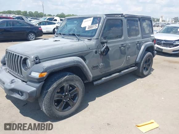 2021 Jeep Wrangler Unlimited 80th Anniversary with VIN 1C4HJXDG2MW700489, listed as a IAAI auction lot 43018398 with 43,611 mi miles and . Bid and sale history available at DreamBid. Image 17.