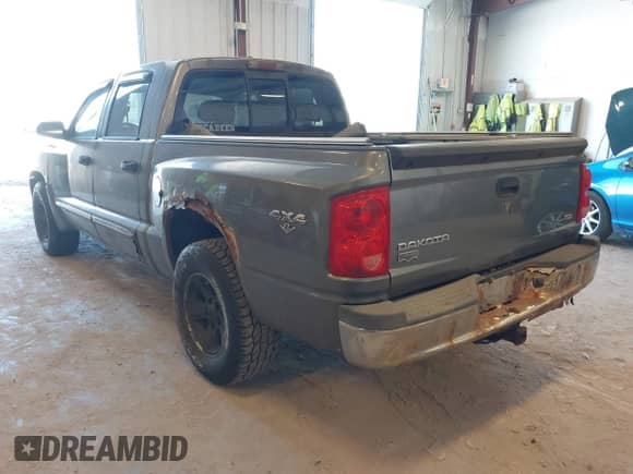 2008 Dodge Dakota Laramie with VIN 1D7HW58N58S602395, listed as a IAAI auction lot 42062915 with 166,161 mi miles and . Bid and sale history available at DreamBid. Image 3.