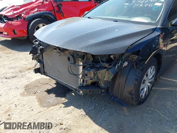 2022 Toyota Camry Hybrid LE with VIN 4T1C31AK9NU592164, listed as a IAAI auction lot 43394960 with 56,727 mi miles and . Bid and sale history available at DreamBid. Image 6.