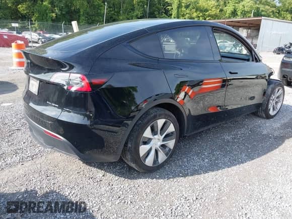 2023 Tesla Model Y Long Range with VIN 7SAYGDEE7PF825882, listed as a IAAI auction lot 42975990 with 44,109 mi miles and . Bid and sale history available at DreamBid. Image 4.