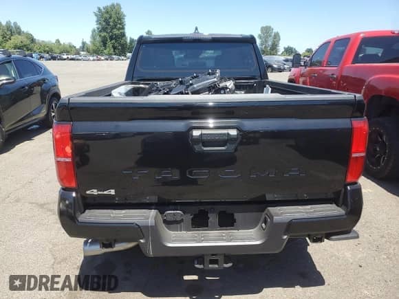2024 Toyota Tacoma TRD Off Road with VIN 3TMLB5JN1RM085942, listed as a Copart auction lot 64483585 with 1,975 mi miles and Salvage title. Bid and sale history available at DreamBid. Image 6.