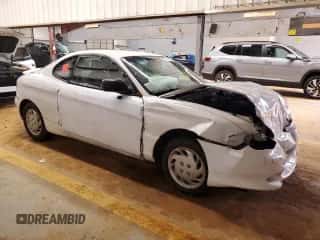 1997 Hyundai Tiburon с VIN KMHJG24M6VU052589, выставлен на аукционе Copart как лот 45118235 с пробегом 90 609 миль миль и Списание • Salvage title. История ставок и продаж доступна на DreamBid. Изображение 4.