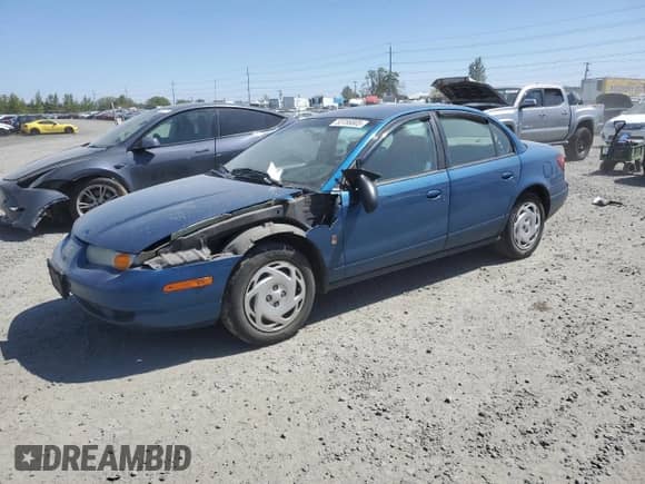 2001 Saturn SL with VIN 1G8ZK547X1Z294553, listed as a Copart auction lot 53786805 with 288,011 mi miles and Salvage title. Bid and sale history available at DreamBid. Image 1.