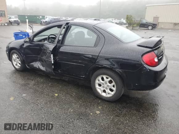 2002 Dodge Neon ES with VIN 1B3ES56C02D577803, listed as a Copart auction lot 58838175 with 72,105 mi miles and Salvage title. Bid and sale history available at DreamBid. Image 2.