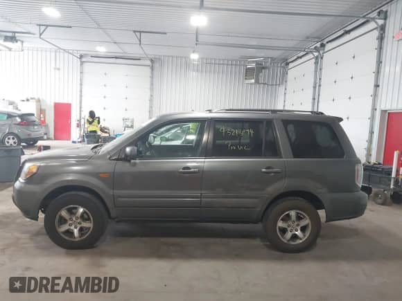2007 Honda Pilot EX with VIN 5FNYF18407B016273, listed as a IAAI auction lot 43213094 with 252,573 mi miles and . Bid and sale history available at DreamBid. Image 14.