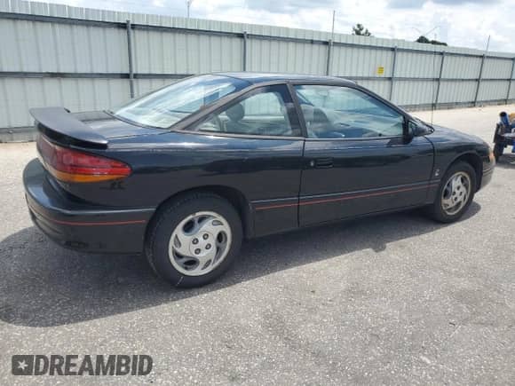 1996 Saturn 2dr Coupe with VIN 1G8ZH1279TZ371071, listed as a Copart auction lot 66602245 with 107,563 mi miles and Salvage title. Bid and sale history available at DreamBid. Image 3.