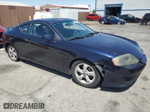 2006 Hyundai Tiburon GS с VIN KMHHM65D06U213565, выставлен на аукционе Copart как лот 58727645 с пробегом 163 844 миль миль и Списание • Salvage title. История ставок и продаж доступна на DreamBid. Изображение 4.