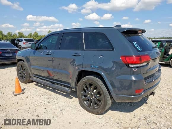 2018 Jeep Grand Cherokee Altitude with VIN 1C4RJFAG0JC294261, listed as a Copart auction lot 85189515 with 106,945 mi miles and Salvage title. Bid and sale history available at DreamBid. Image 2.