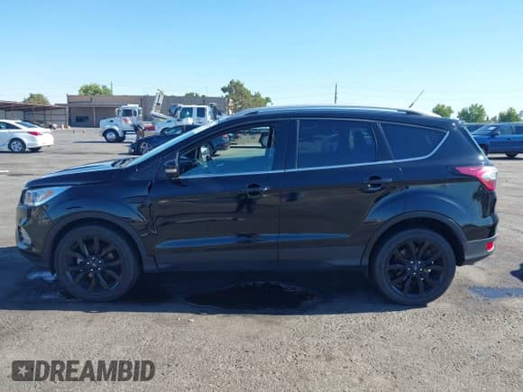 2017 Ford Escape Titanium with VIN 1FMCU0JD6HUE90933, listed as a IAAI auction lot 43035309 with 76,661 mi miles and . Bid and sale history available at DreamBid. Image 15.
