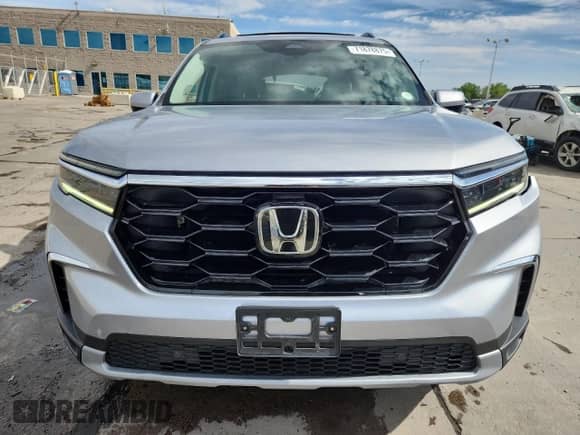 2023 Honda Pilot Touring с VIN 5FNYG1H70PB012750, выставлен на аукционе Copart как лот 71878875 с пробегом 26 304 миль миль и Списание • Salvage title. История ставок и продаж доступна на DreamBid. Изображение 5.