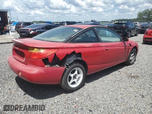 2001 Saturn SC with VIN 1G8ZY12791Z233074, listed as a Copart auction lot 60476085 with 130,323 mi miles and Salvage title. Bid and sale history available at DreamBid. Image 3.