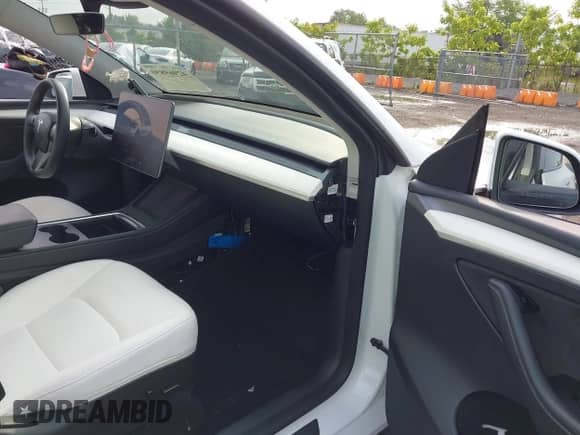 2023 Tesla Model Y Long Range with VIN 7SAYGDEE5PF633389, listed as a IAAI auction lot 42969850 with 16,889 mi miles and . Bid and sale history available at DreamBid. Image 5.