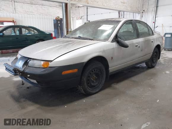 2001 Saturn SL with VIN 1G8ZJ54751Z324075, listed as a IAAI auction lot 43387665 with Not provided miles and . Bid and sale history available at DreamBid. Image 2.