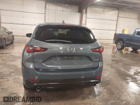 2022 Mazda CX-5 S Carbon Edition z VIN JM3KFBCM3N0527885, wystawiony jako IAAI lot #41226356 z przebiegiem 25 691 mil mil oraz . Historia ofert i sprzedaży dostępna na DreamBid. Obrazek 16.