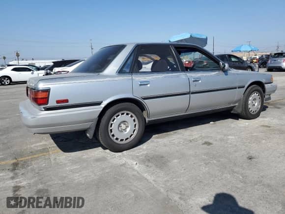 1990 Toyota Camry with VIN JT2VV22E3L3003353, listed as a Copart auction lot 68489125 with 131,662 mi miles and Clean title. Bid and sale history available at DreamBid. Image 3.