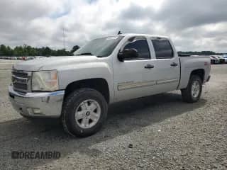 2013 Chevrolet Silverado 1500 LT with VIN 3GCPCSE0XDG119394, listed as a Copart auction lot 63251265 with 185,531 mi miles and Salvage title. Bid and sale history available at DreamBid. Image 1.