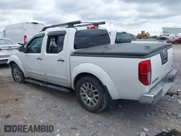 2009 Nissan Frontier SE with VIN 1N6AD07U19C427701, listed as a IAAI auction lot 42613374 with 164,412 mi miles and . Bid and sale history available at DreamBid. Image 3.