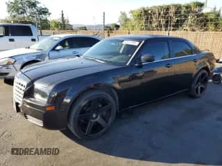 2007 Chrysler 300 with VIN 2C3KA43R17H707657, listed as a Copart auction lot 82241695 with 153,950 mi miles and Salvage title. Bid and sale history available at DreamBid. Image 1.