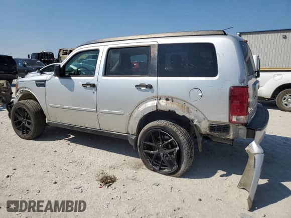 2008 Dodge Nitro SLT with VIN 1D8GT58K48W235584, listed as a Copart auction lot 84613424 with 219,494 mi miles and Salvage title. Bid and sale history available at DreamBid. Image 2.