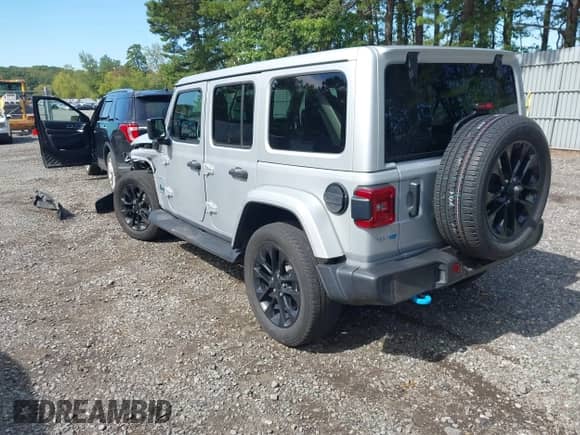 2023 Jeep Wrangler Sahara with VIN 1C4JJXP6XPW516832, listed as a IAAI auction lot 43140022 with 26,710 mi miles and . Bid and sale history available at DreamBid. Image 3.