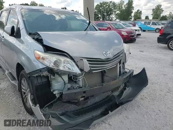 2012 Toyota Sienna XLE with VIN 5TDYK3DC6CS235796, listed as a Copart auction lot 70565525 with 120,990 mi miles and Clean title. Bid and sale history available at DreamBid. Image 14.