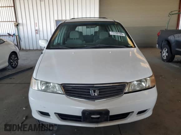 2001 Honda Odyssey EX with VIN 2HKRL18631H544011, listed as a Copart auction lot 71720105 with 175,757 mi miles and Salvage title. Bid and sale history available at DreamBid. Image 5.