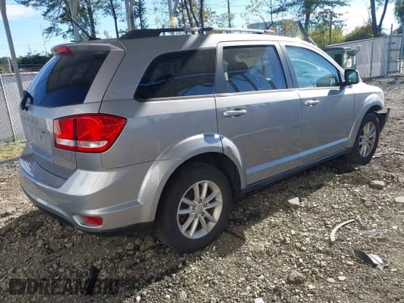 2017 Dodge Journey SXT z VIN 3C4PDCBG3HT602789, wystawiony jako IAAI lot #43486576 z przebiegiem 198 339 mil mil oraz . Historia ofert i sprzedaży dostępna na DreamBid. Obrazek 4.