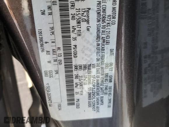 2013 Ford Focus Titanium with VIN 1FADP3J29DL129007, listed as a Copart auction lot 66289165 with 72,489 mi miles and Salvage title. Bid and sale history available at DreamBid. Image 12.