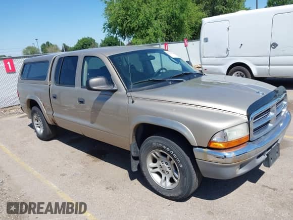 2004 Dodge Dakota SLT with VIN 1D7HL48N04S653798, listed as a IAAI auction lot 42520546 with 115,259 mi miles and . Bid and sale history available at DreamBid. Image 1.