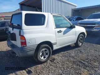 1999 Chevrolet Tracker z VIN 2CNBE18C2X6924158, wystawiony jako IAAI lot #43523088 z przebiegiem 134 515 mil mil oraz . Historia ofert i sprzedaży dostępna na DreamBid. Obrazek 4.