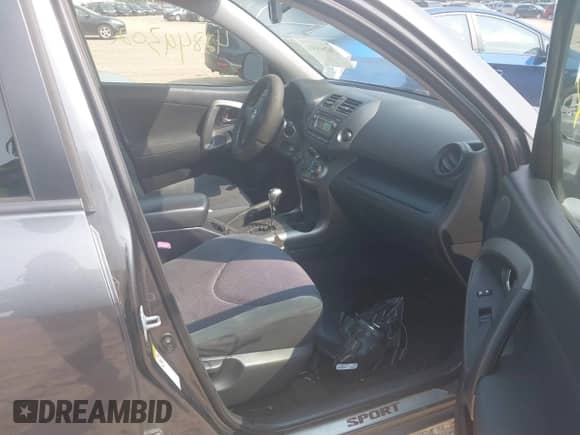 2012 Toyota RAV4 Sport with VIN JTMRF4DV2C5052501, listed as a IAAI auction lot 42849302 with 227,531 mi miles and . Bid and sale history available at DreamBid. Image 5.