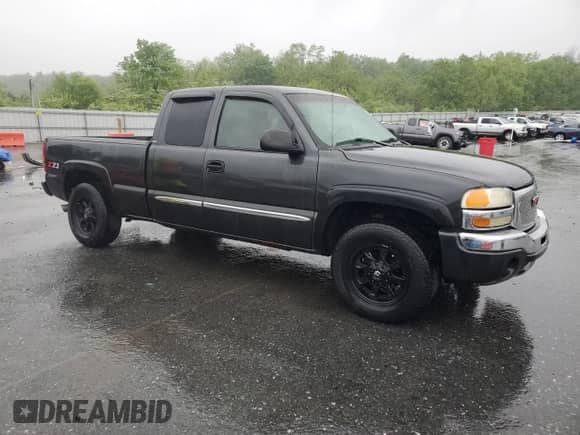 2003 GMC Sierra 1500 SLE with VIN 2GTEK19T731328981, listed as a Copart auction lot 56709645 with 242,866 mi miles and Salvage title. Bid and sale history available at DreamBid. Image 4.