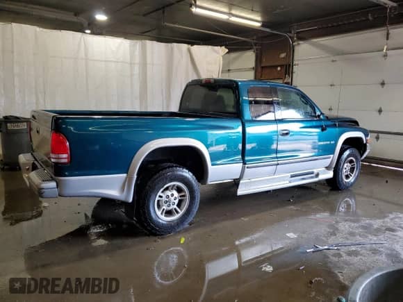 1999 Dodge Dakota SLT z VIN 1B7GG22Y5XS203084, wystawiony jako Copart lot #59273975 z przebiegiem 172 017 mil mil oraz Szkoda całkowita • Salvage title. Historia ofert i sprzedaży dostępna na DreamBid. Obrazek 3.