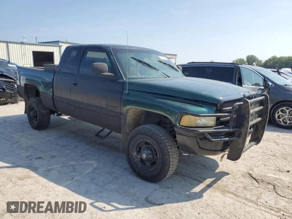 2002 Dodge 2500 with VIN 3B7KF23622M281527, listed as a Copart auction lot 70297065 with 317,620 mi miles and Salvage title. Bid and sale history available at DreamBid. Image 4.