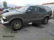 1999 Chevrolet Blazer LS with VIN 1GNDT13W3X2209981, listed as a Copart auction lot 84297504 with 226,641 mi miles and Salvage title. Bid and sale history available at DreamBid. Image 1.