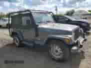 2001 Jeep Wrangler SE with VIN 1J4FA29P41P355548, listed as a Copart auction lot 56214205 with 173,125 mi miles and Clean title. Bid and sale history available at DreamBid. Image 4.