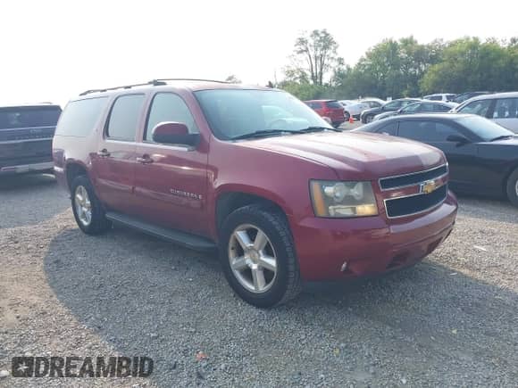 2007 Chevrolet Suburban LT z VIN 1GNFC16J27J216127, wystawiony jako IAAI lot #43141201 z przebiegiem 214 749 mil mil oraz . Historia ofert i sprzedaży dostępna na DreamBid. Obrazek 1.