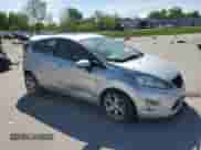 2011 Ford Fiesta SES with VIN 3FADP4FJ5BM200284, listed as a Copart auction lot 57276395 with 161,849 mi miles and Salvage title. Bid and sale history available at DreamBid. Image 4.
