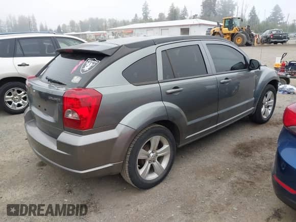 2011 Dodge Caliber Mainstreet with VIN 1B3CB3HA6BD254282, listed as a IAAI auction lot 43203478 with 73,592 mi miles and . Bid and sale history available at DreamBid. Image 4.