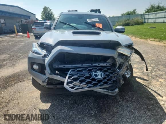 2020 Toyota Tacoma SR5 z VIN 3TMCZ5AN3LM365185, wystawiony jako Copart lot #65887715 z przebiegiem 123 533 mil mil oraz Szkoda całkowita • Salvage title. Historia ofert i sprzedaży dostępna na DreamBid. Obrazek 5.