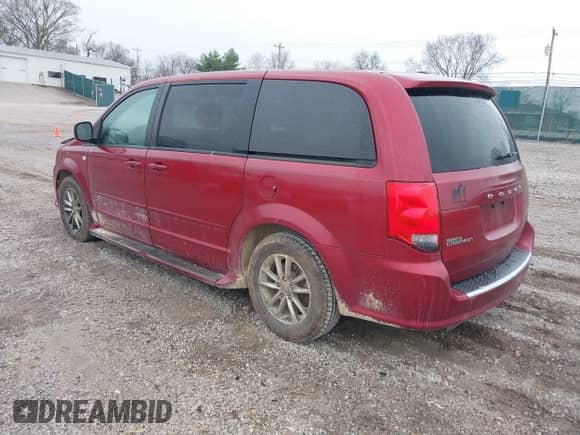 2014 Dodge Grand Caravan SXT with VIN 2C4RDGBG2ER406809, listed as a IAAI auction lot 41493003 with 183,208 mi miles and . Bid and sale history available at DreamBid. Image 3.