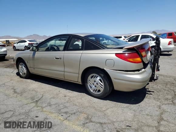 1999 Saturn SC with VIN 1G8ZY1277XZ299213, listed as a Copart auction lot 63788405 with 54,699 mi miles and Salvage title. Bid and sale history available at DreamBid. Image 2.