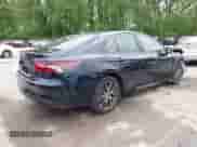 2021 Toyota Camry Hybrid XLE with VIN 4T1F31AK8MU563752, listed as a IAAI auction lot 42134620 with 19,484 mi miles and . Bid and sale history available at DreamBid. Image 4.