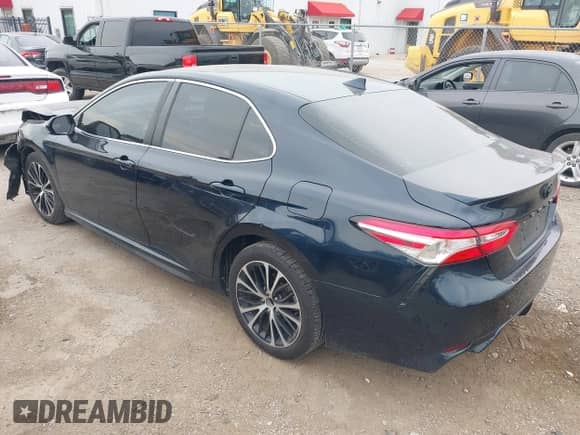 2020 Toyota Camry SE with VIN 4T1G11AK4LU955992, listed as a IAAI auction lot 43027088 with 77,002 mi miles and . Bid and sale history available at DreamBid. Image 3.