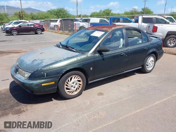 1999 Saturn SL z VIN 1G8ZK5274XZ351289, wystawiony jako IAAI lot #41734679 z przebiegiem 140 006 mil mil oraz . Historia ofert i sprzedaży dostępna na DreamBid. Obrazek 2.