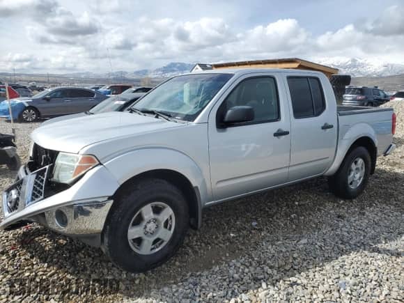 2005 Nissan Frontier SE z VIN 1N6AD07W95C455998, wystawiony jako Copart lot #51514145 z przebiegiem 135 000 mil mil oraz Szkoda całkowita • Salvage title. Historia ofert i sprzedaży dostępna na DreamBid. Obrazek 1.