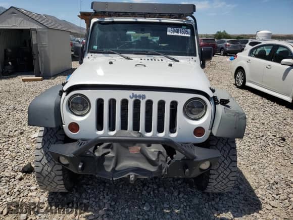 2011 Jeep Wrangler Rubicon with VIN 1J4BA6D12BL535953, listed as a Copart auction lot 59401595 with 77,451 mi miles and Salvage title. Bid and sale history available at DreamBid. Image 5.
