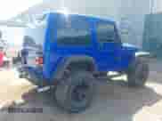 2000 Jeep Wrangler Sport with VIN 1J4FA49S0YP735660, listed as a IAAI auction lot 43192698 with Not provided miles and . Bid and sale history available at DreamBid. Image 4.